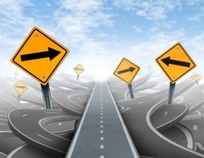 street signs in a tangle of highways